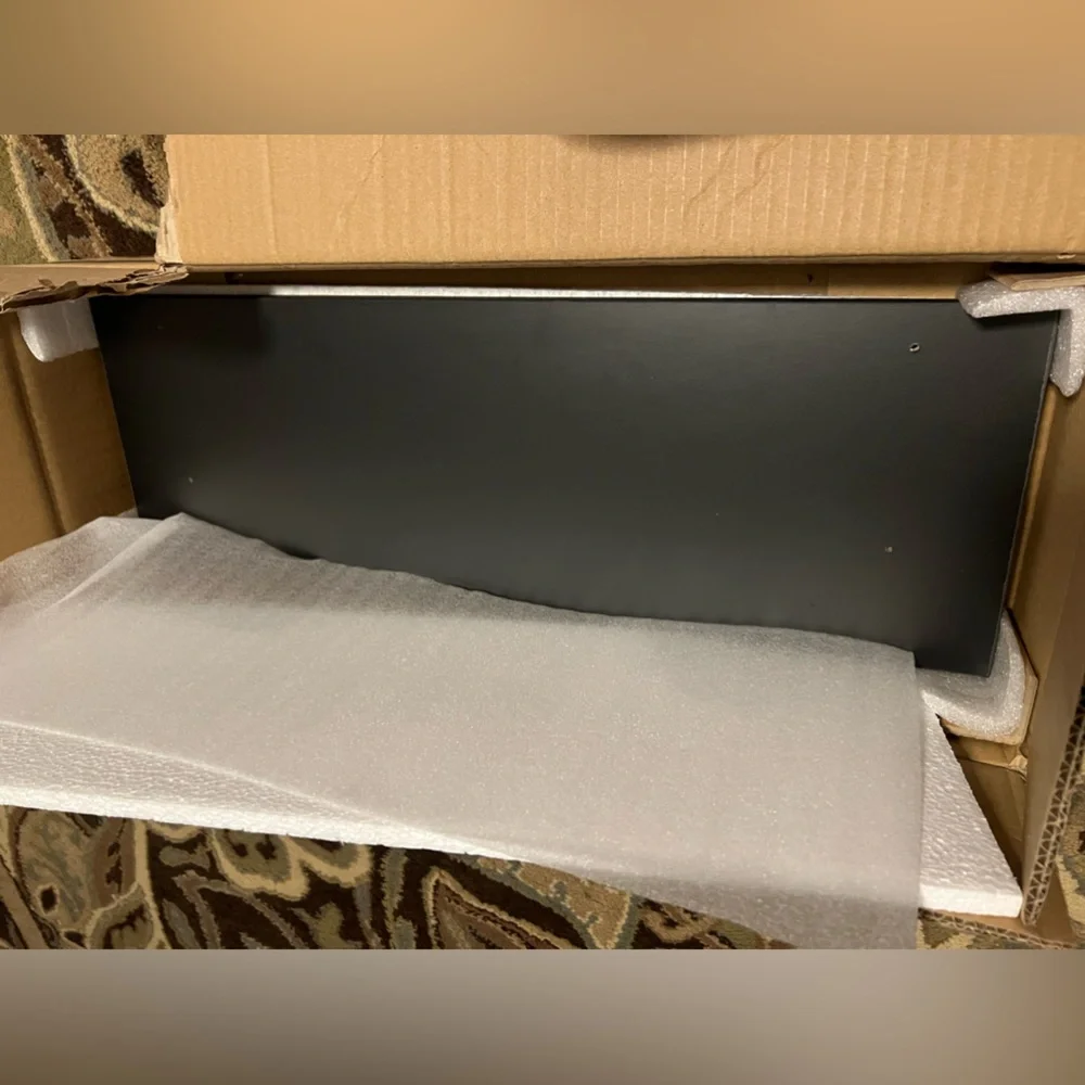 Black wall shelf with brackets